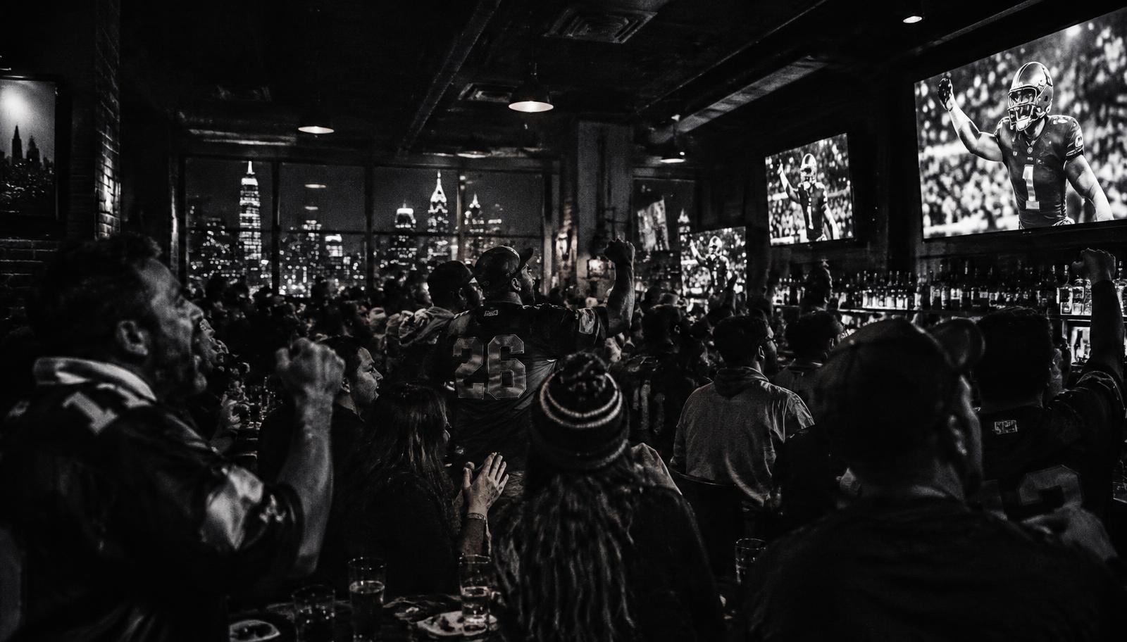 Raiders fans watching the game at a Philly bar